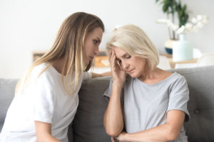 a woman confronting her friend about the signs of a functioning alcoholic