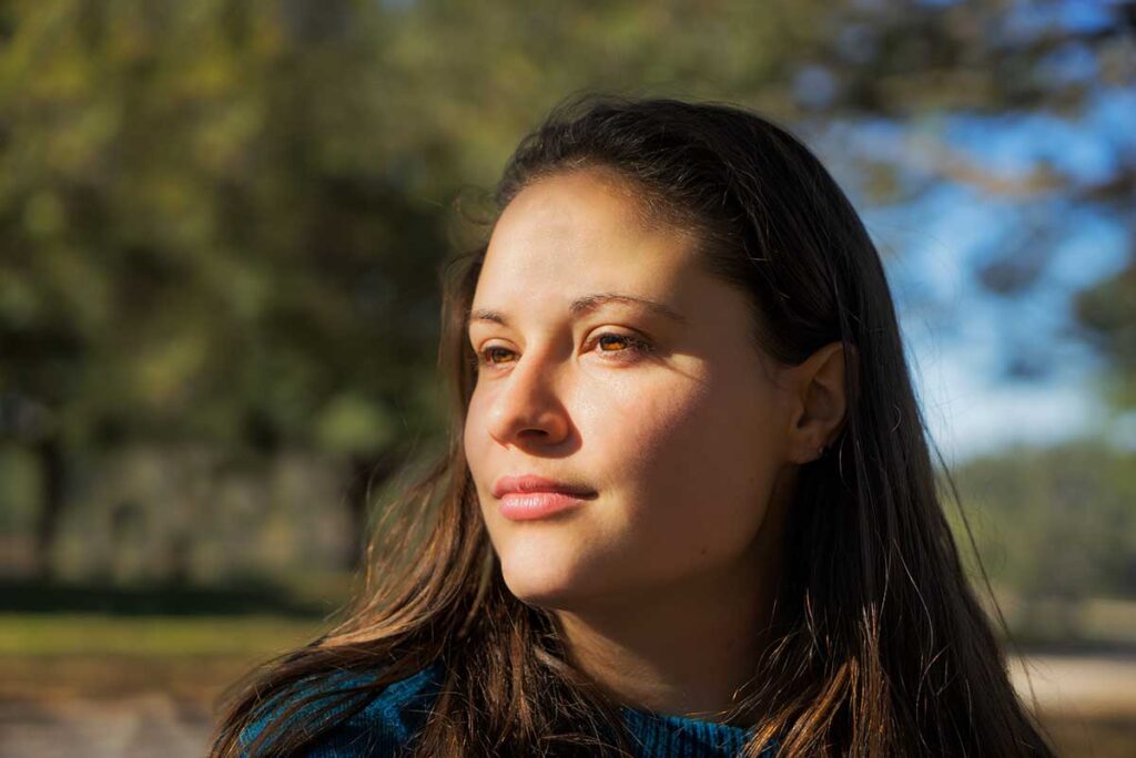 person outdoors enjoying fresh air as one of many coping skills for anxiety